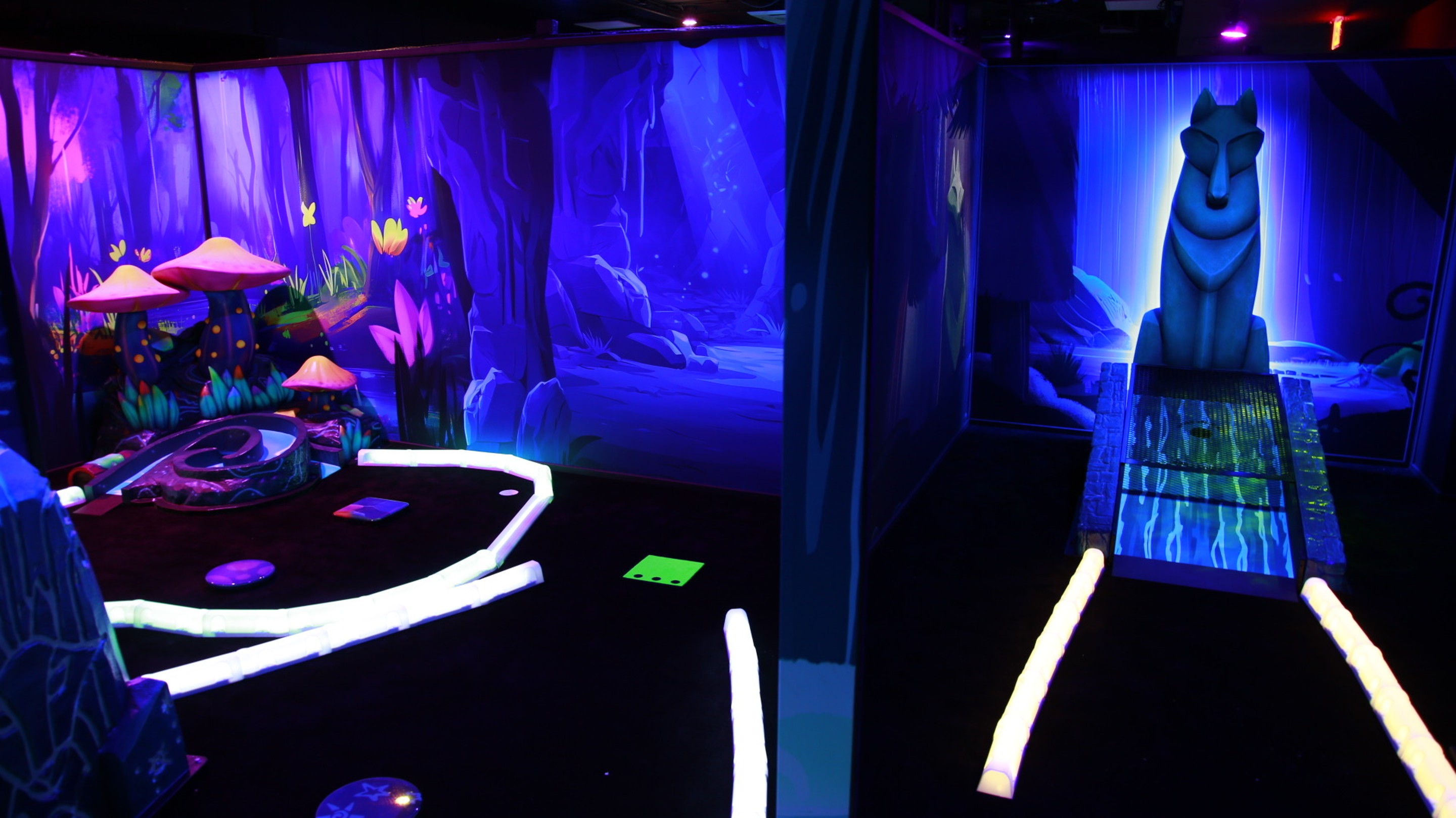 Family looking on as son putts