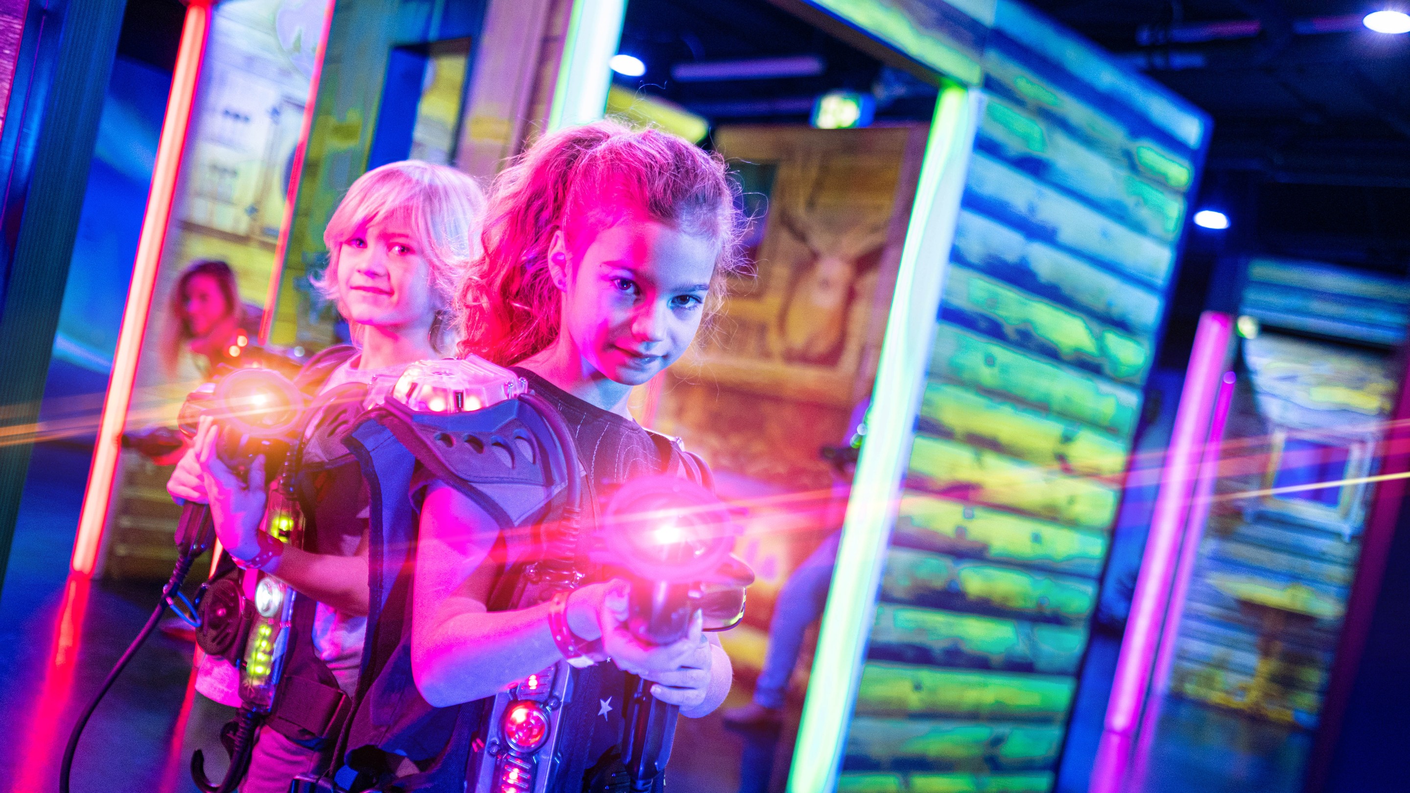Siblings playing Laser tag