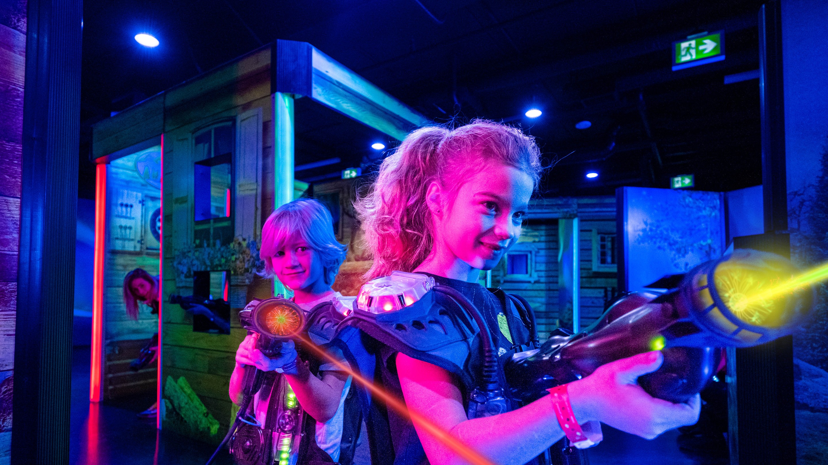 Family enjoying Laser Tag game together