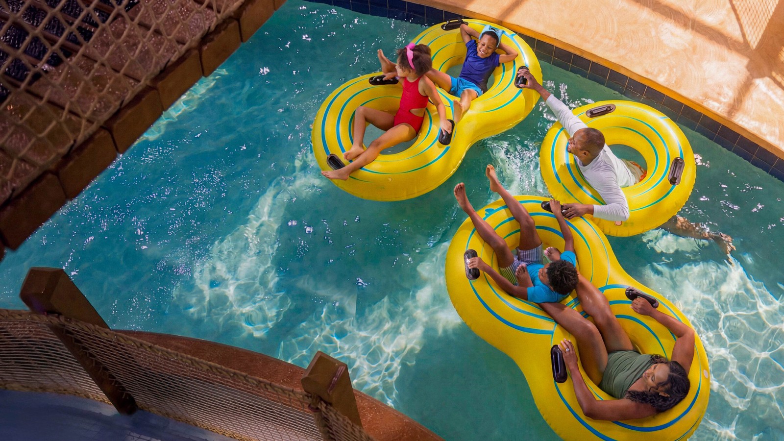 family riding tubes on the lazy river water attraction