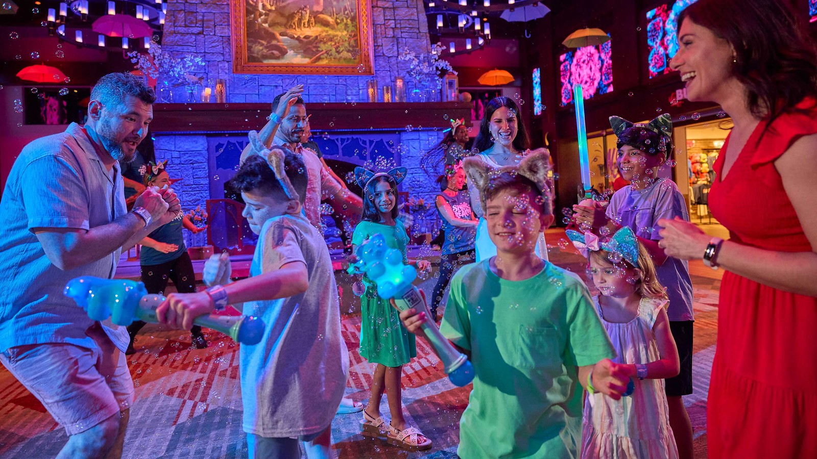 A family dancing and playing with bubbles in a fun setting