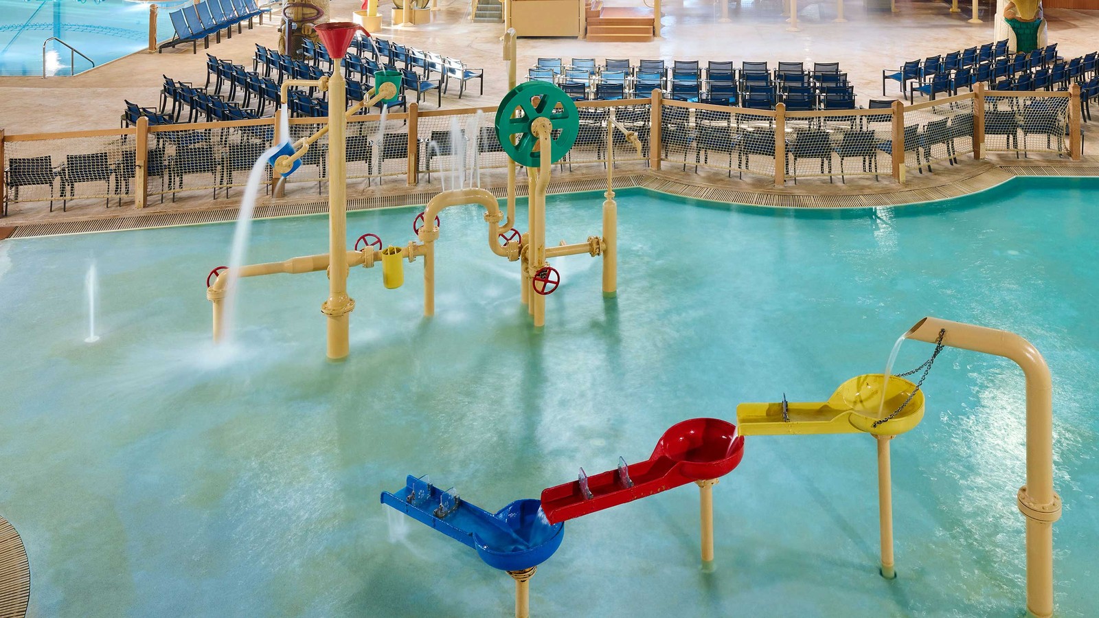 Indoor water park featuring slides, pools, and play areas for families and children.