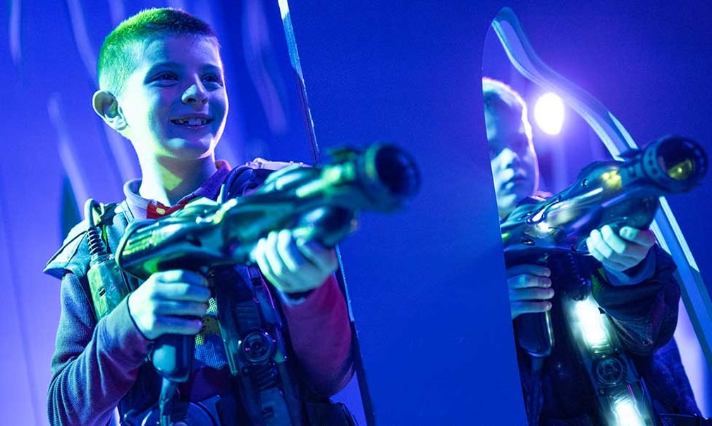 teenagers playing laser trail game
