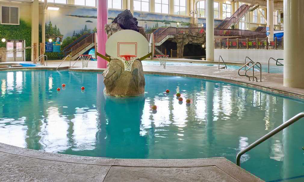 basketball hoop and balls in an indoor sports pool 