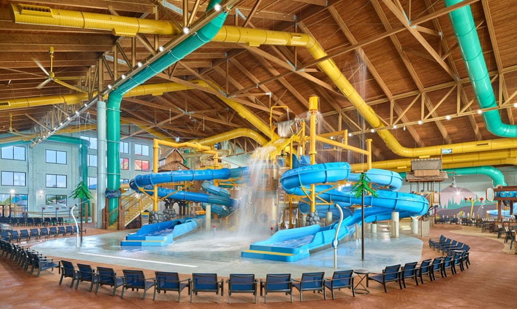 A wide shot of the water treehouse as water splashes down from a bucket