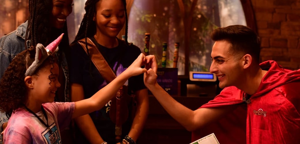 kid being awarded a master magi certificate