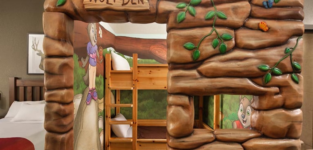 The bed and indoor cave in the Wolf Den Suite at Great Wolf Lodge Charlotte / Concord, NC indoor water park and resort.