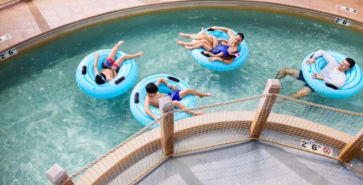 A girl smiling while on her tube at crooked creek