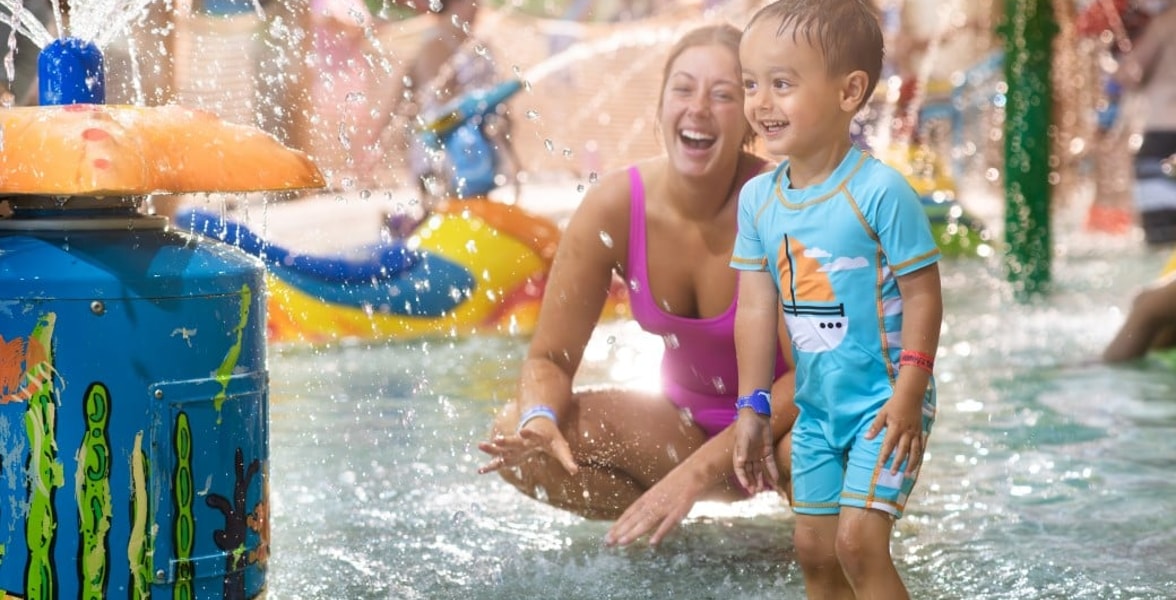 mother and child enjoying in a kidee pool in waterpark