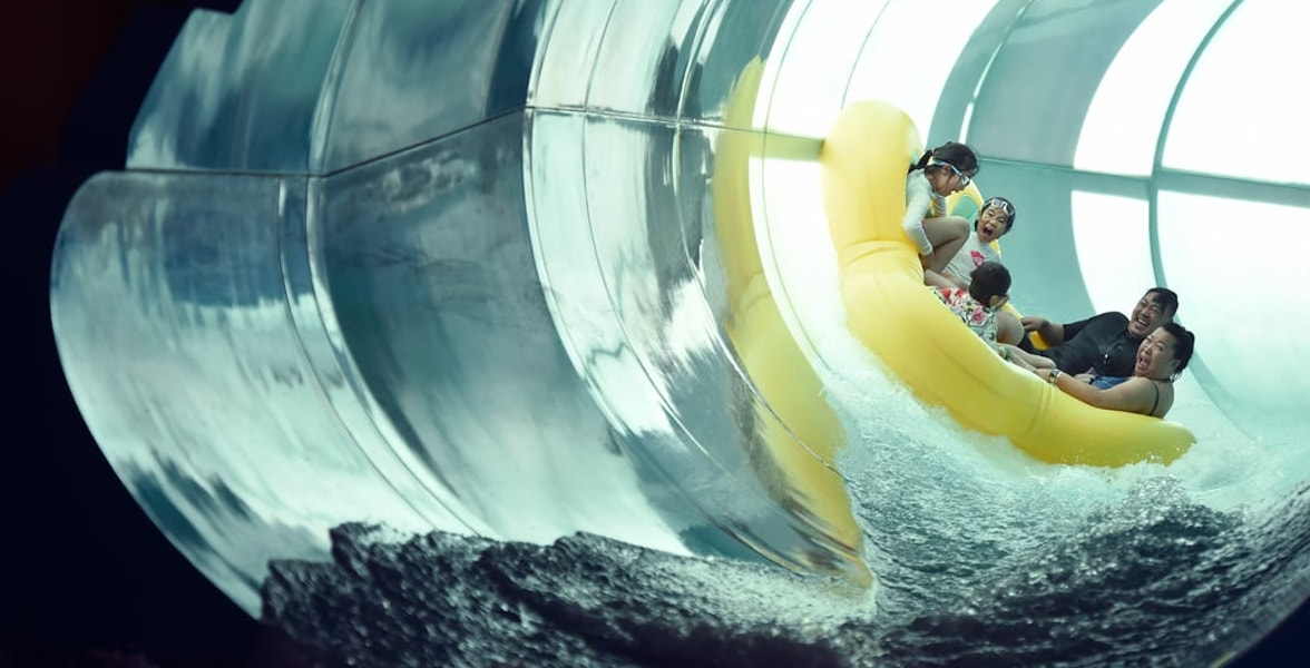Family of five rides down enclosed waterslide 
