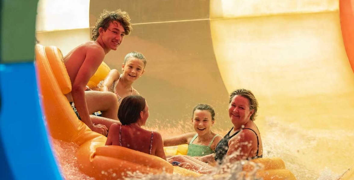 Family of five rides down enclosed waterslide 