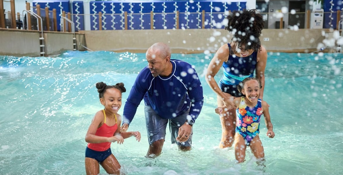 Family of 4 enjoying the waterpark attractions