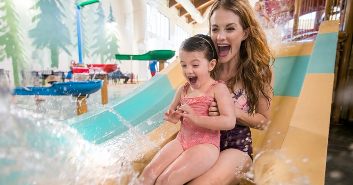 Mom and daughter on a water park slide