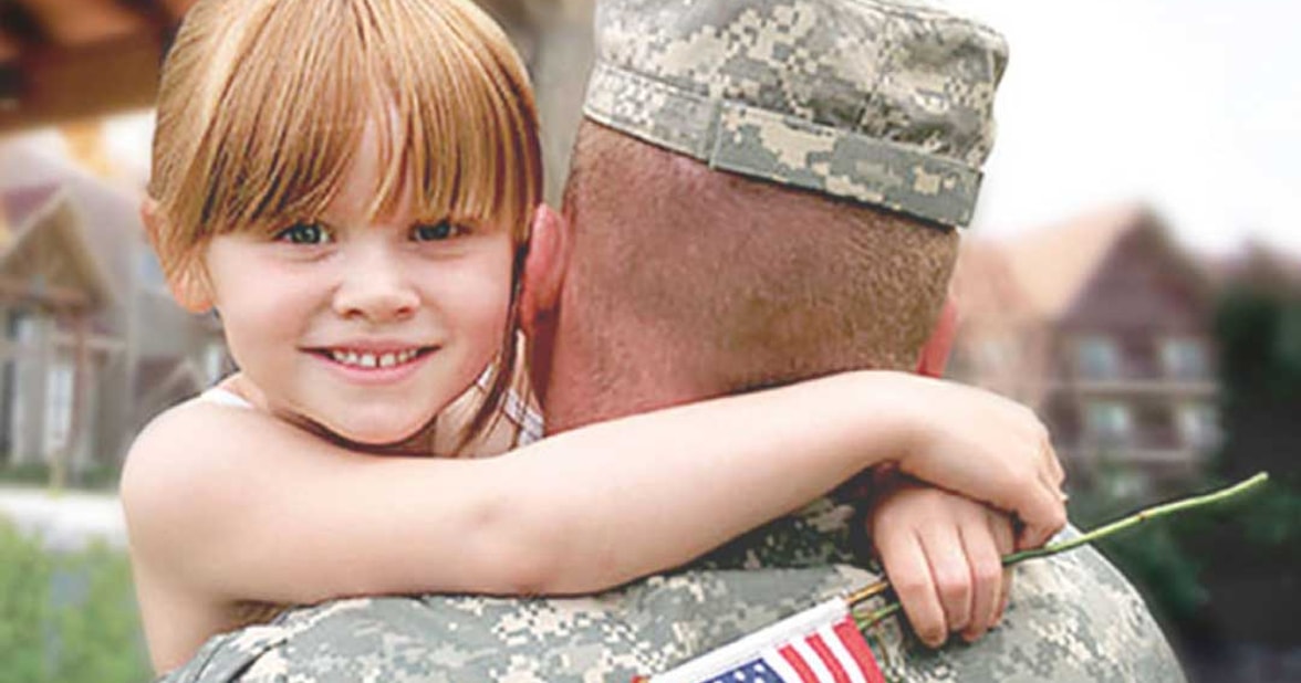 military holding his daughter
