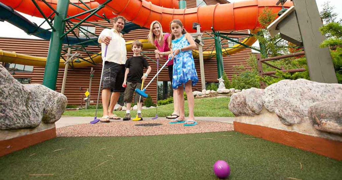 Family enjoys mini golf together