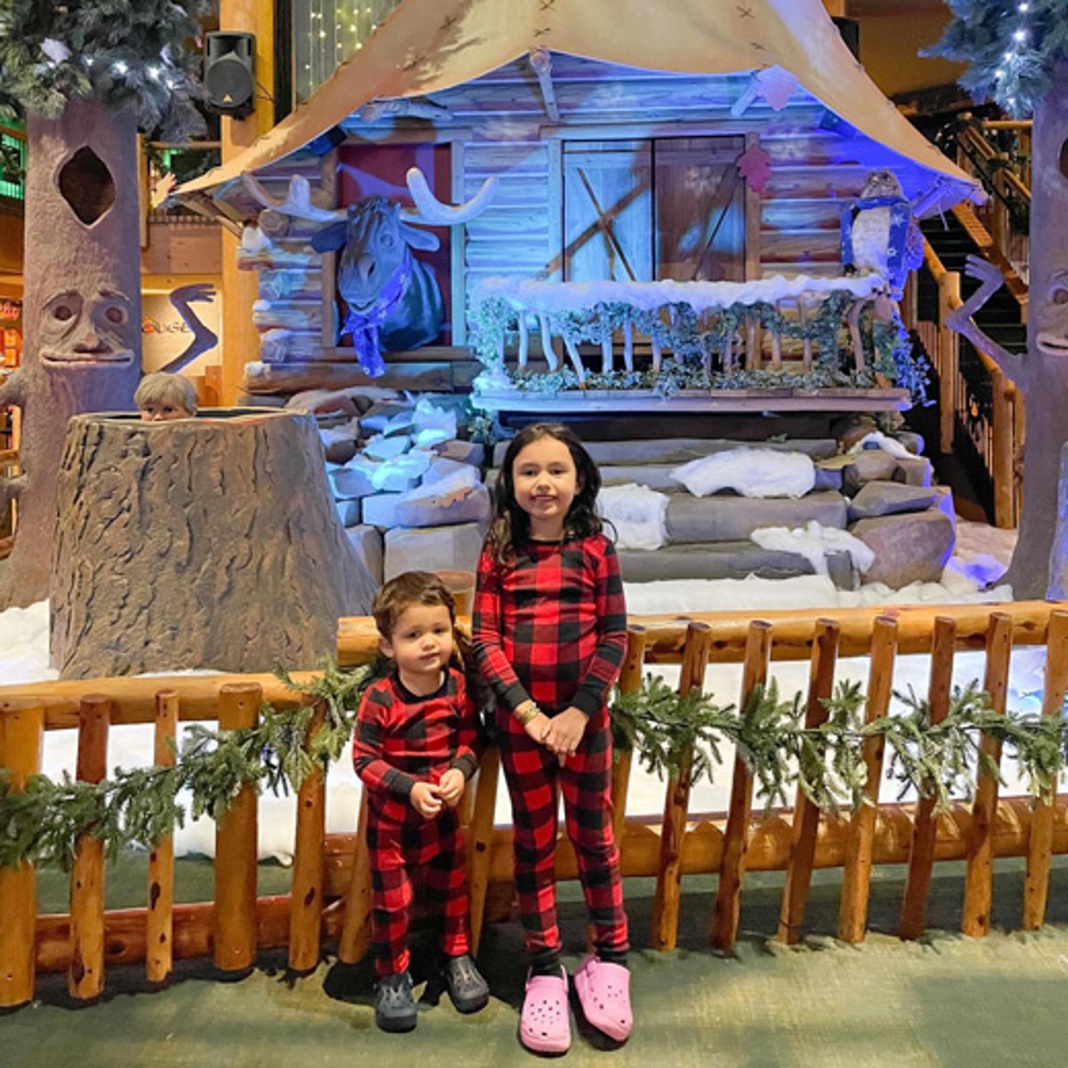 two kids in a winter holiday decor