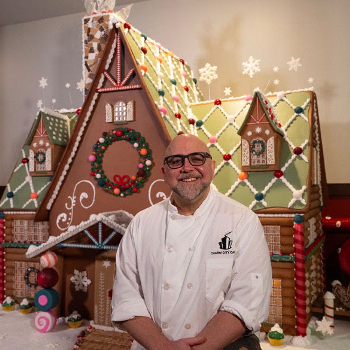 duff goldman showing his gingerbread house creation maryland