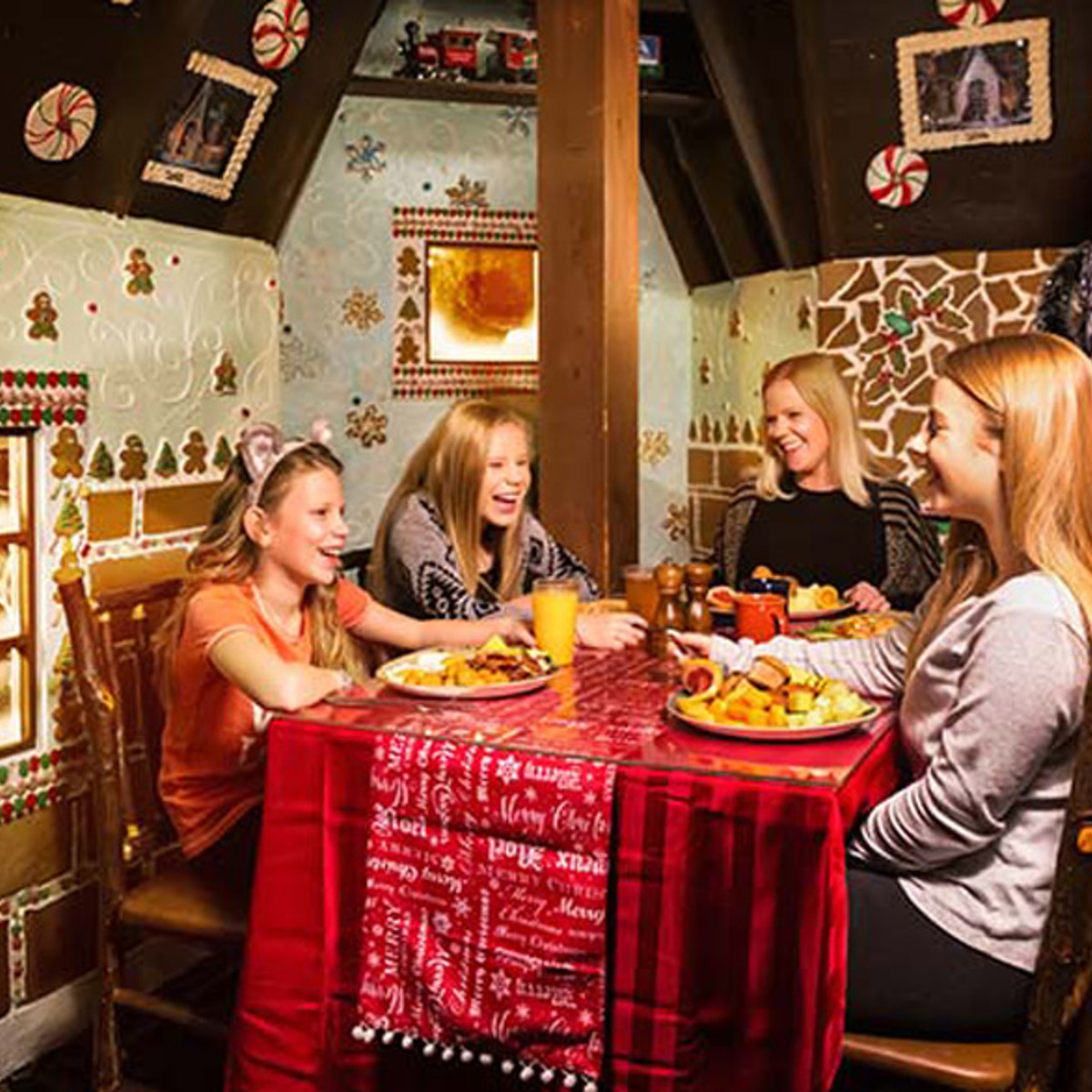 family enjoying dinner in the ginger bread house