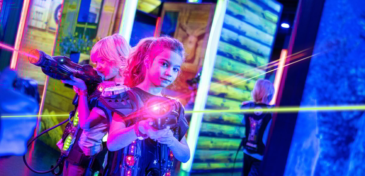 daughters playing with a laser gun