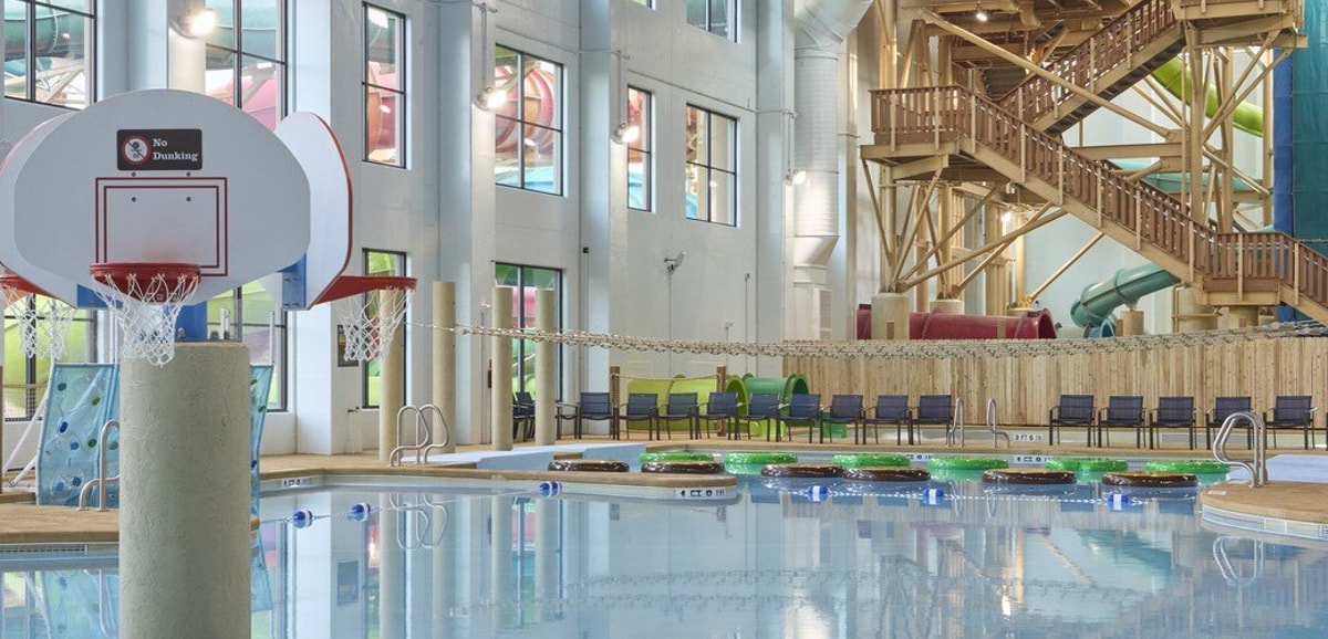 A large indoor pool equipped with a colorful water slide