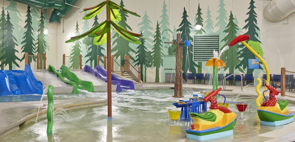 Vibrant water park featuring colorful slides and play areas designed for children.