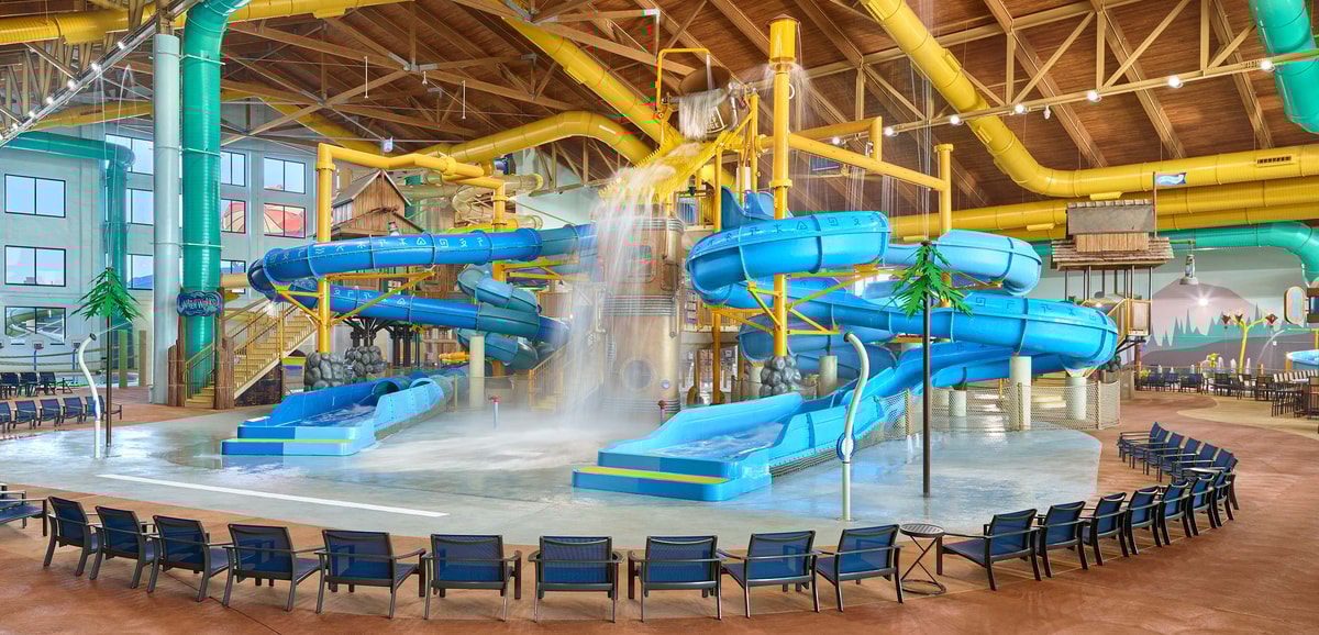 A wide shot of the water treehouse as water splashes down from a bucket