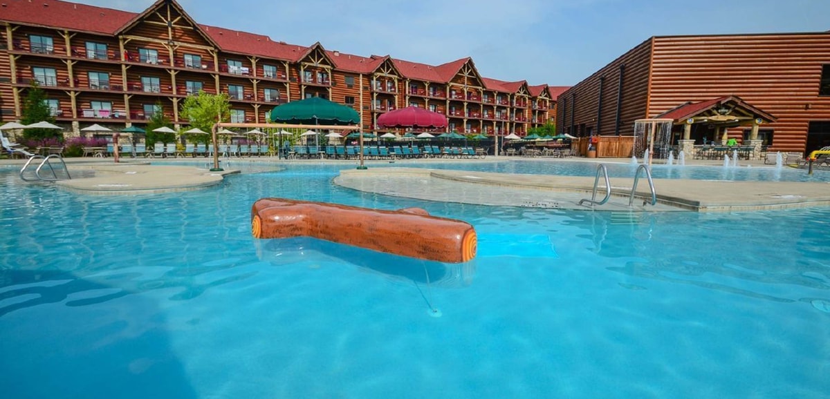 wood play structure in an outdoor pool