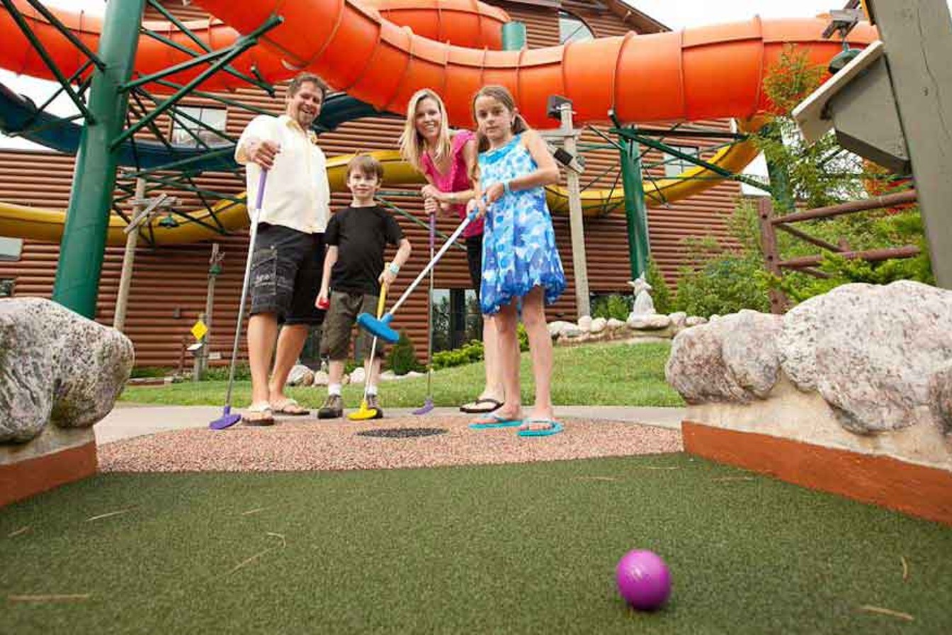 Family enjoys mini golf together