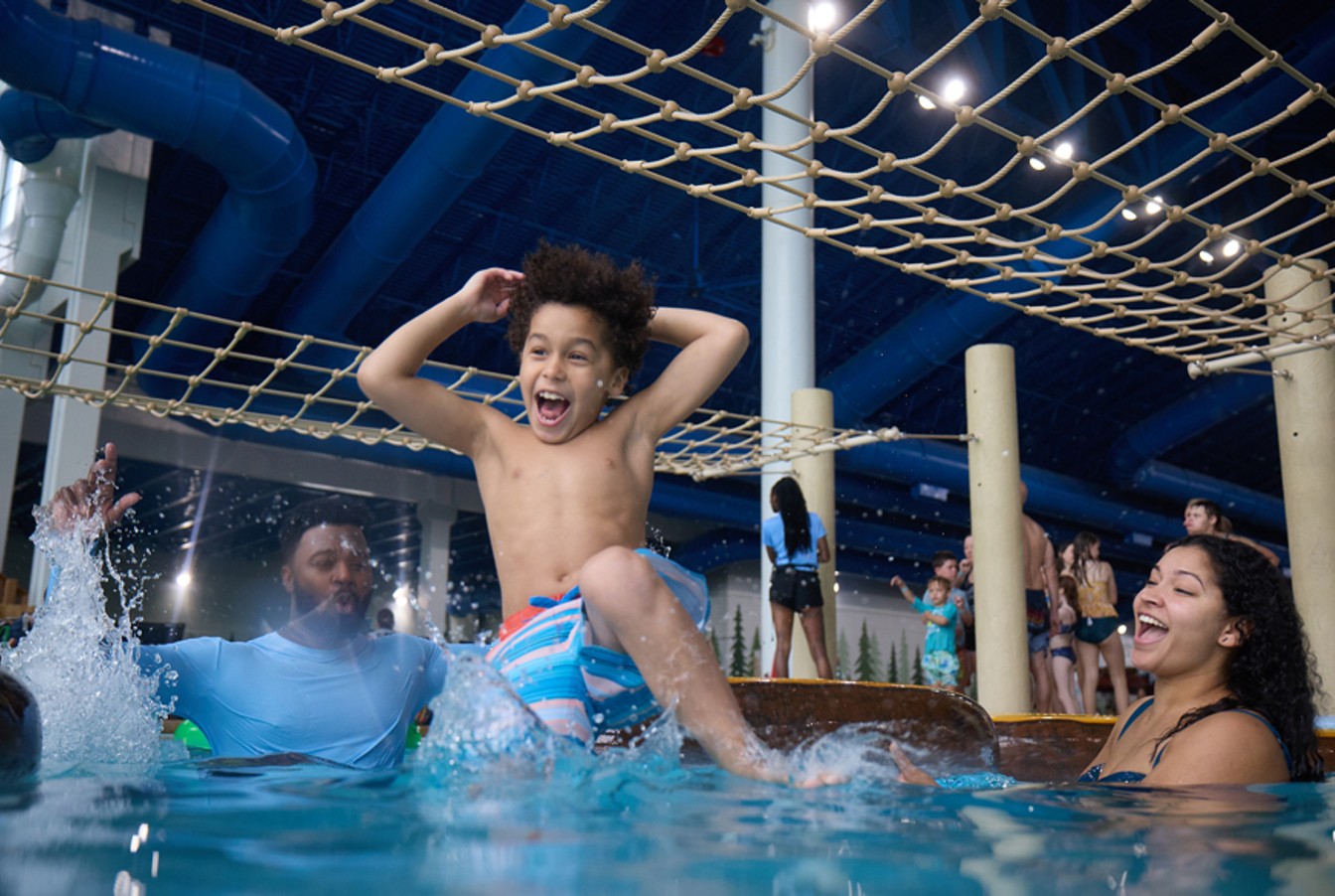 kid jumps into pool as parents watch excitedly