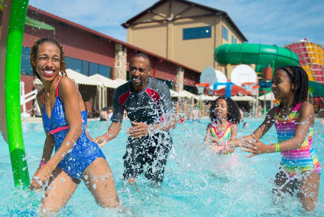 Family enjoying outdoor pool