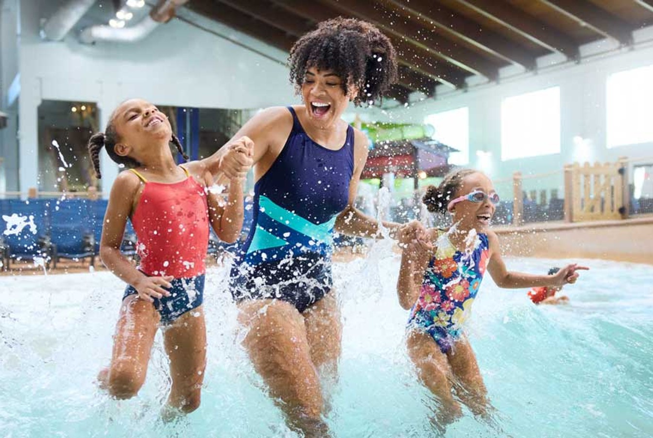 mother and girls enjoying indoor water park