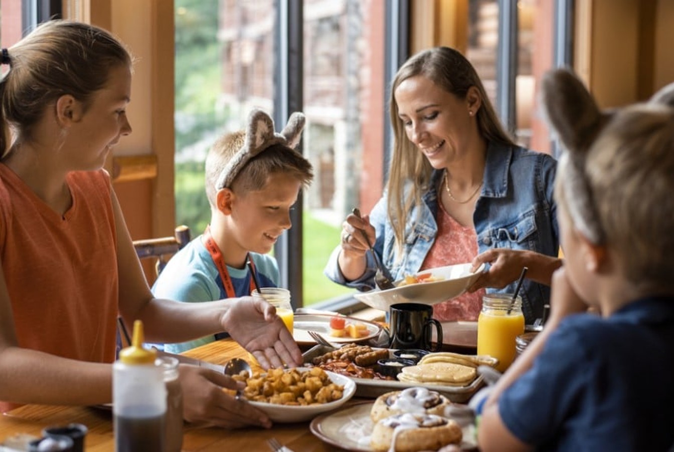 A smiling family having breakfast together