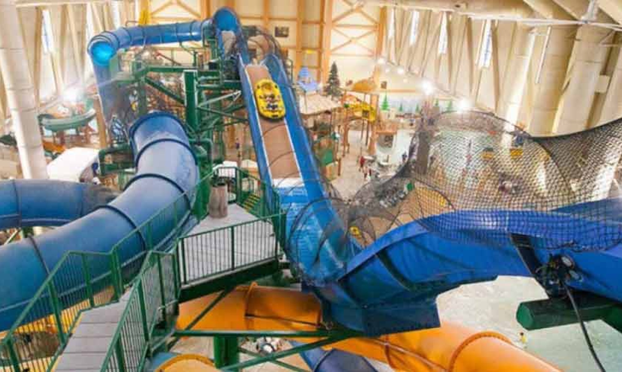 Wide view of the Niagara Rapids Run's multiple tube slides at Great Wolf Lodge indoor water park and resort.