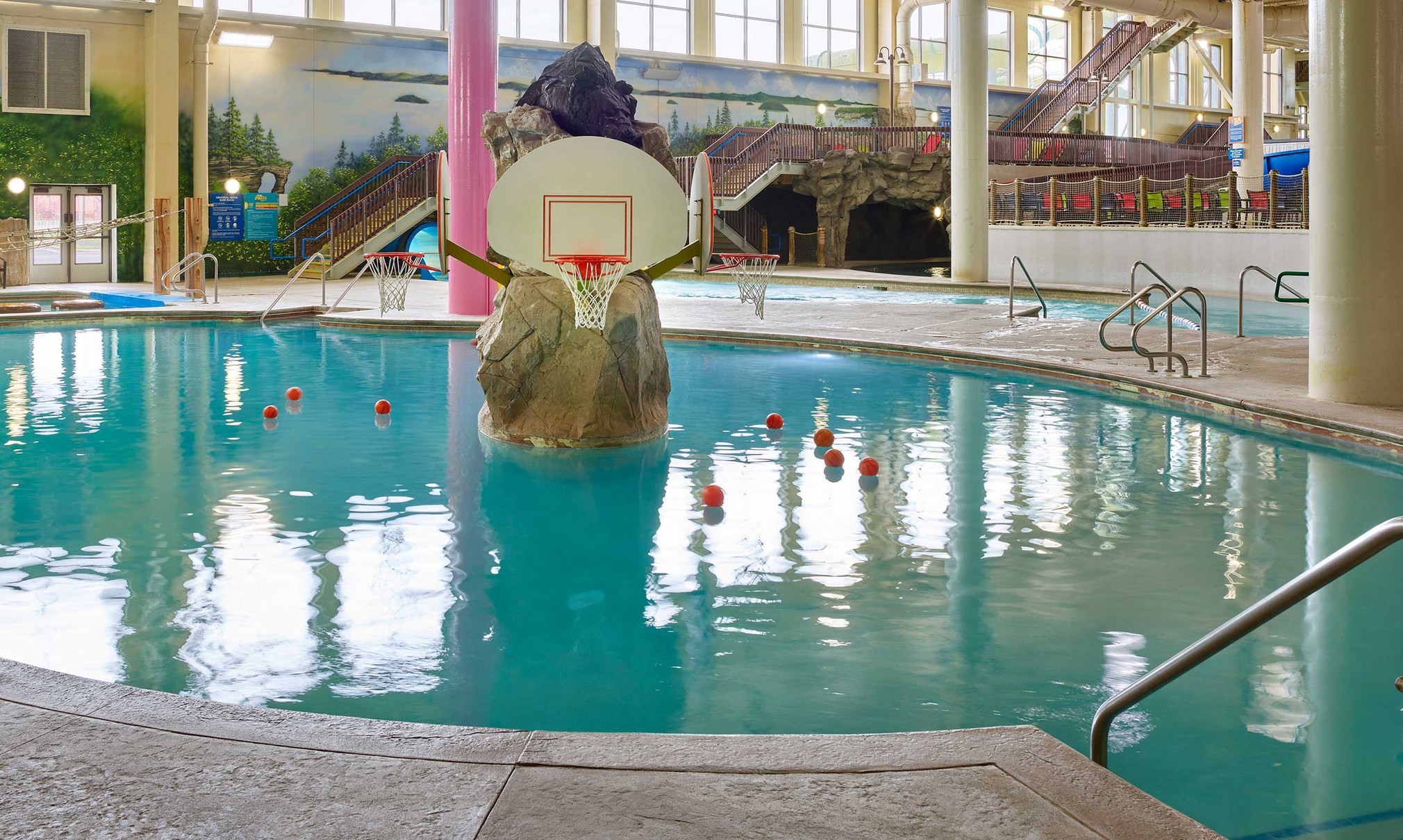 basketball hoop and balls in an indoor sports pool