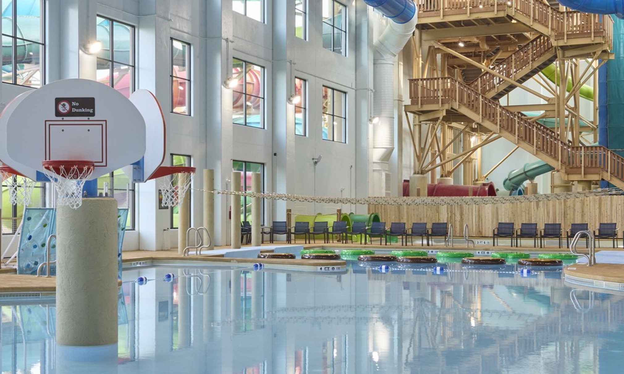 A large indoor pool equipped with a colorful water slide