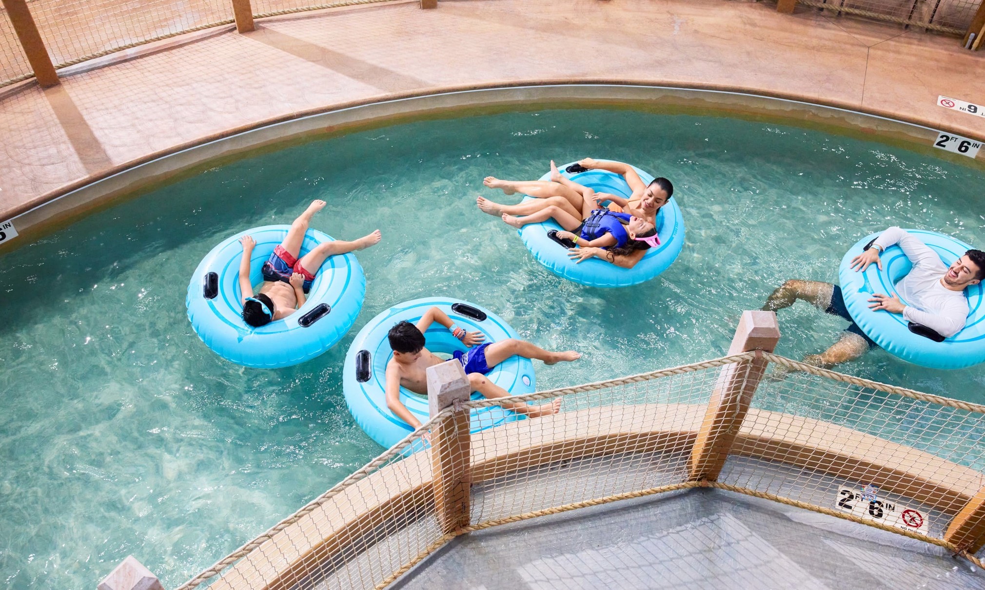 Family riding tubes enjoying the lazy river attraction