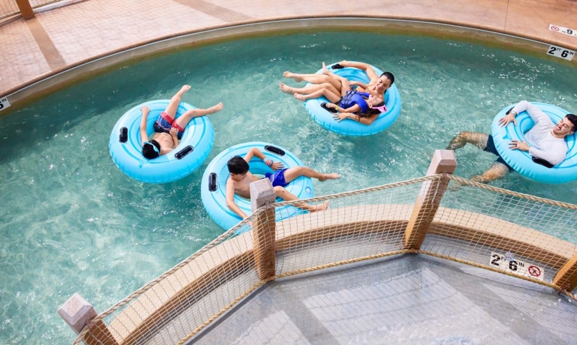 A girl smiling while on her tube at crooked creek