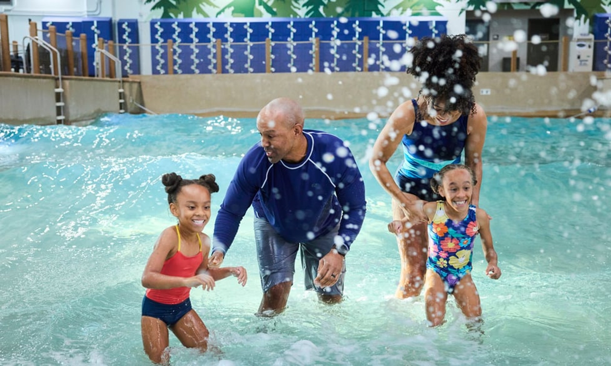 Family of 4 enjoying the waterpark attractions