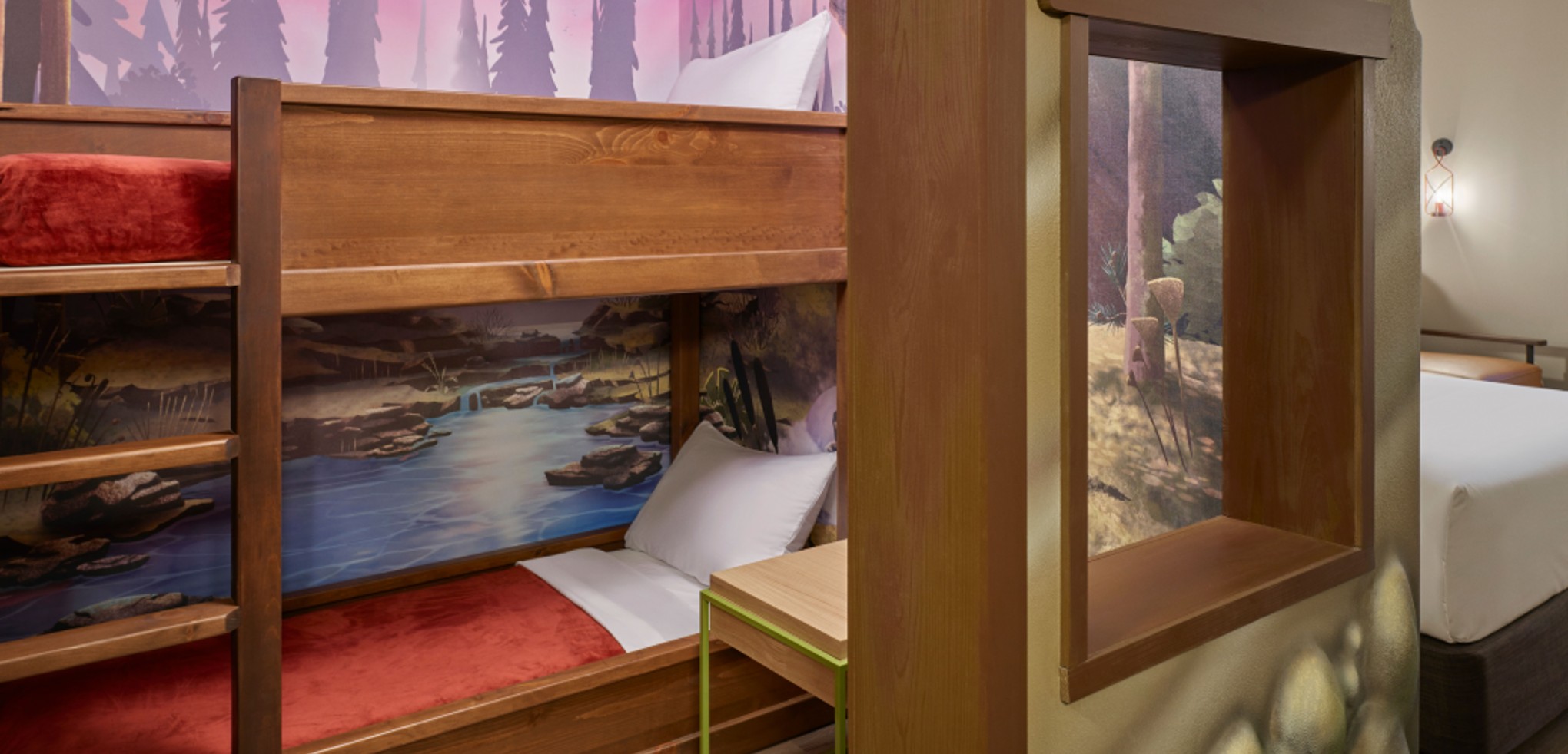 The bed and den inside the Wolf Den Suite at Great Wolf Lodge indoor water park and resort in Sandusky, OH.