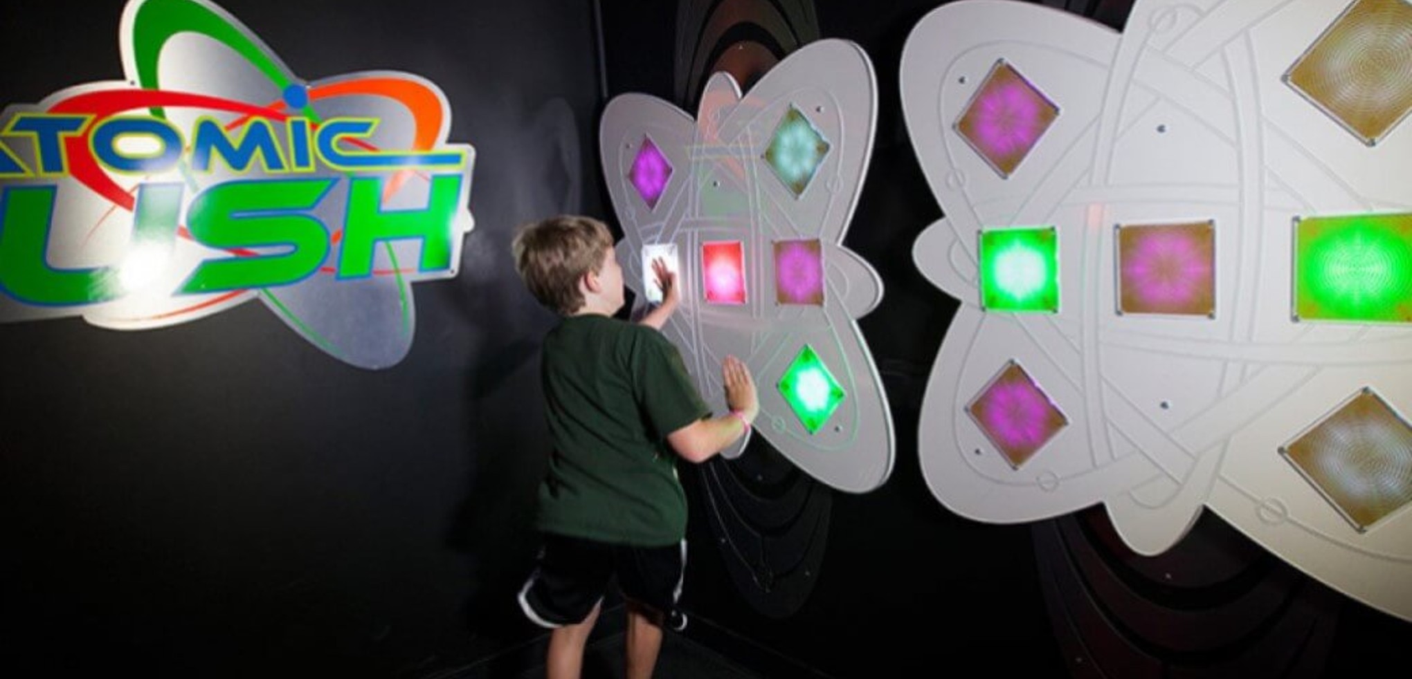 Boys pressing buttons at AtomicRUSH