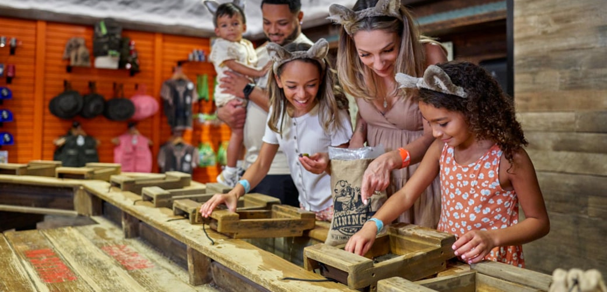 Family interacting with Oliver's mining