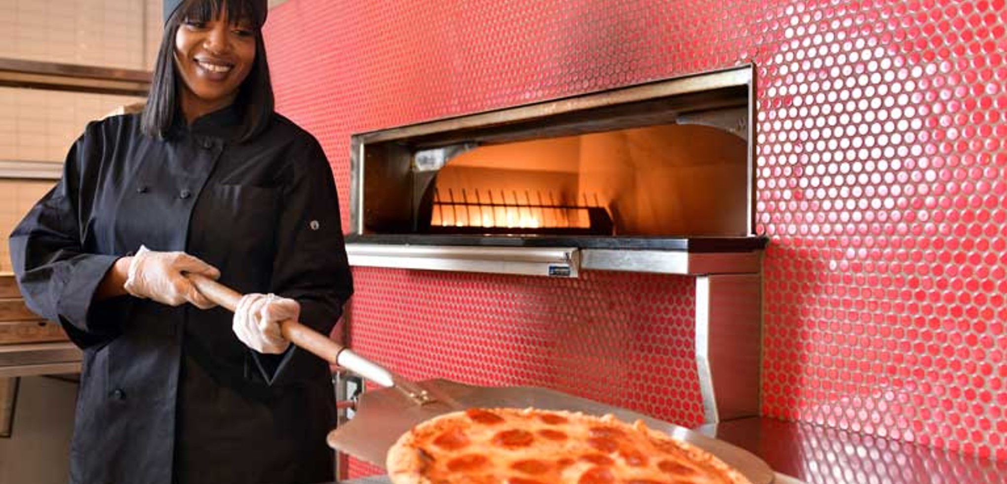 chef baking a Pizza at Hungry as a Wolf