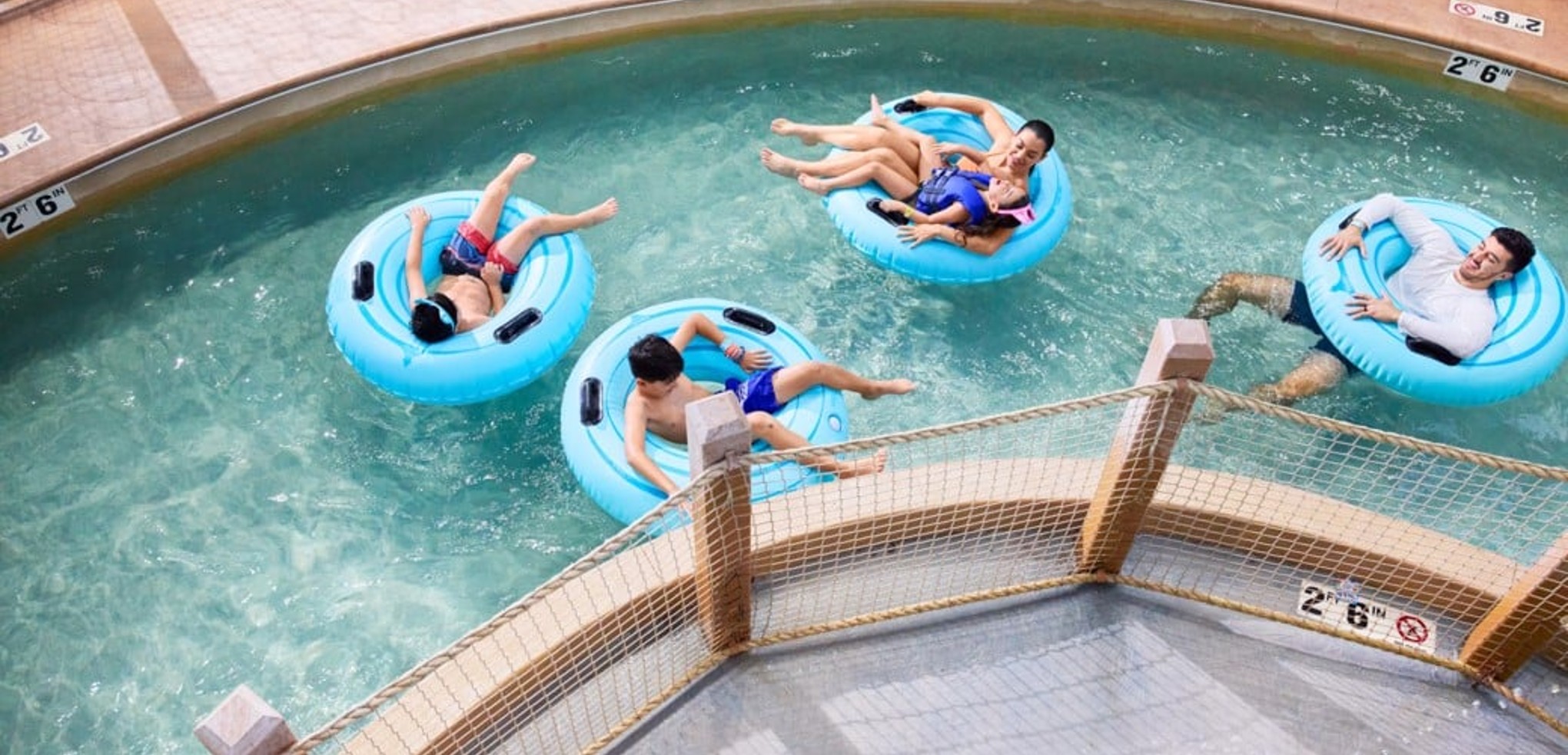 A girl smiling while on her tube at crooked creek