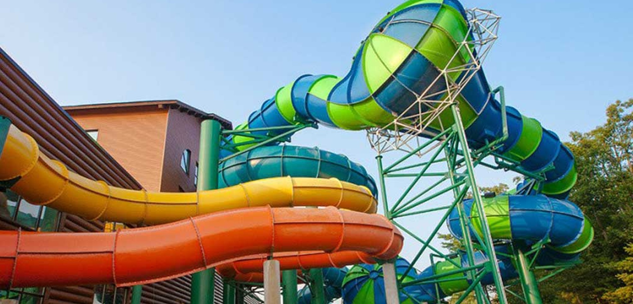 Outside view of three enclosed waterslides 
