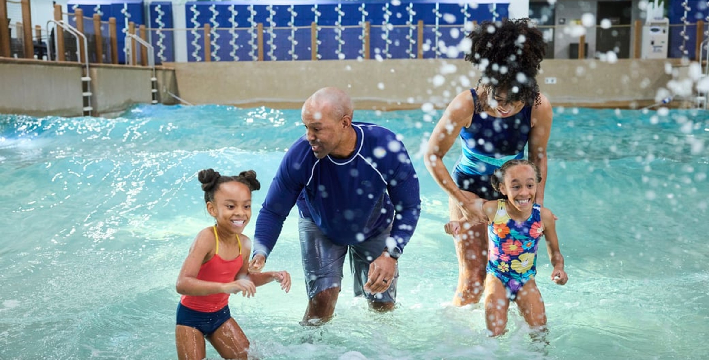 Family of 4 enjoying the waterpark attractions