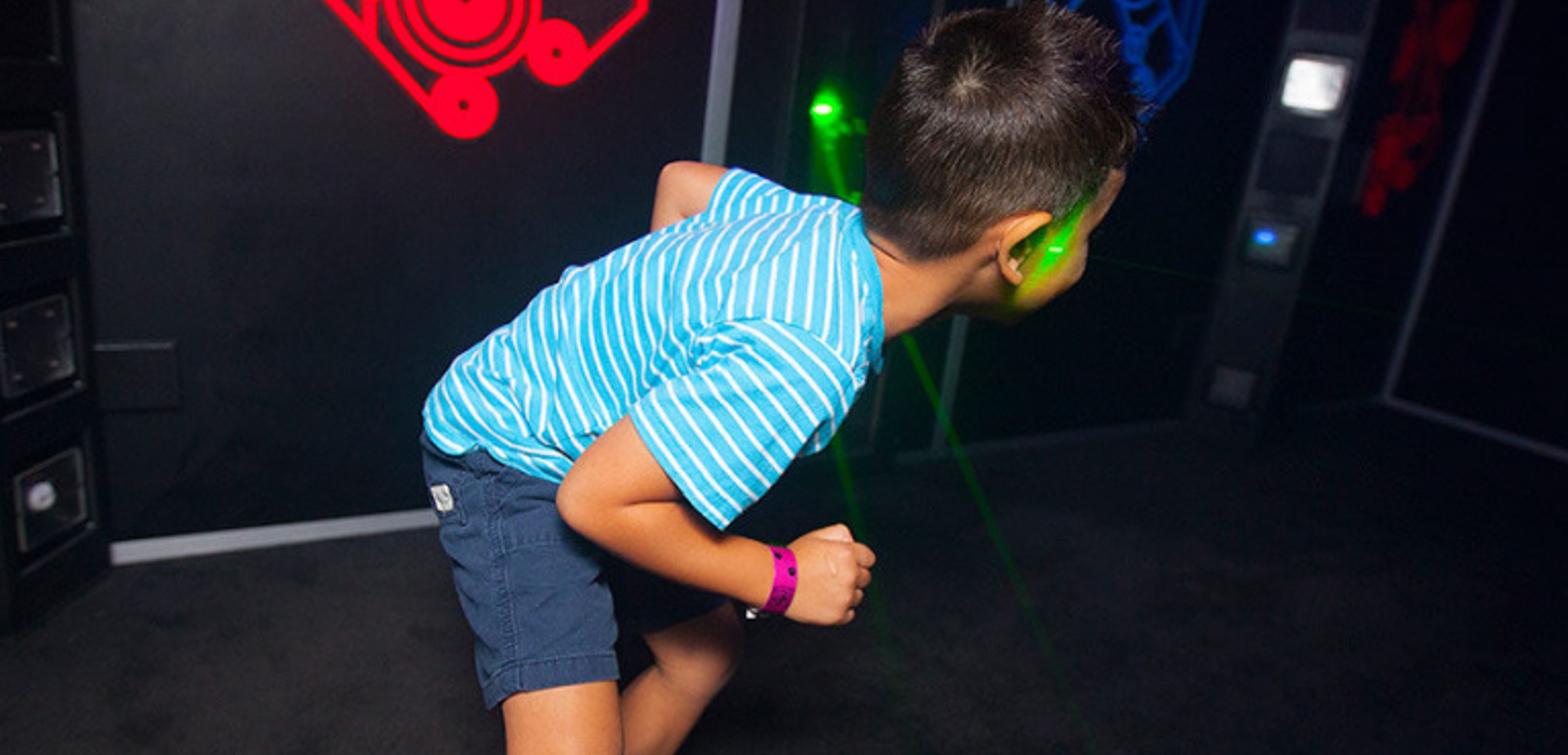 A boy plys Laser Tag at Great Wolf Lodge indoor water park and resort.