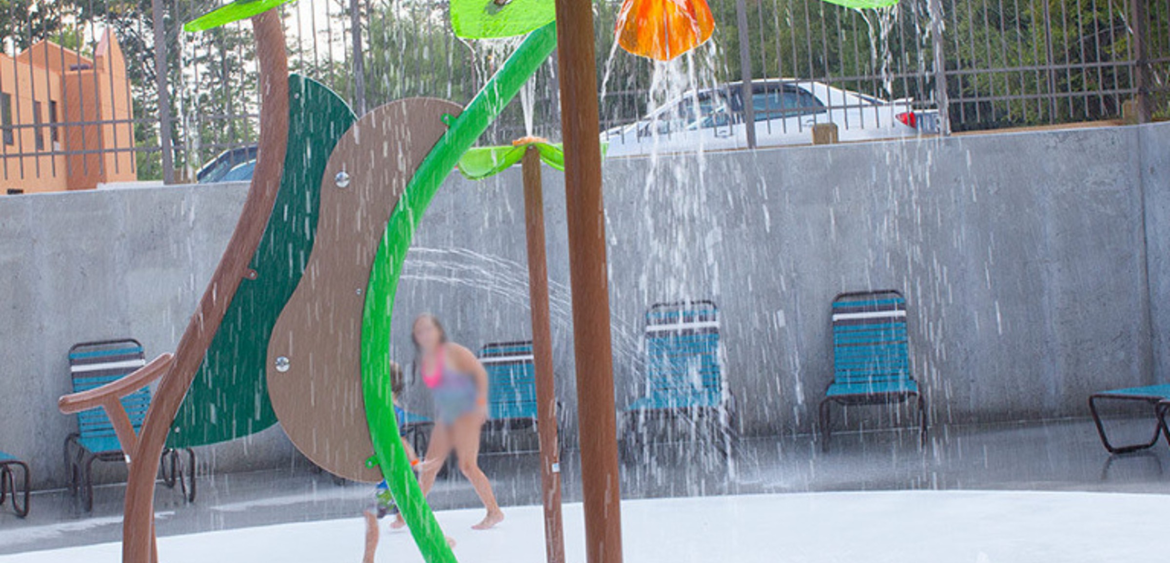 A view of the outdoor water features at Tadpole Pond at Great Wolf Lodge indoor water park and resort.