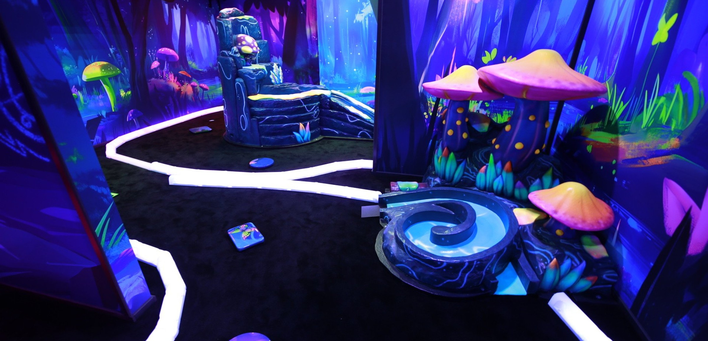 Glow mini golf course with blacklight