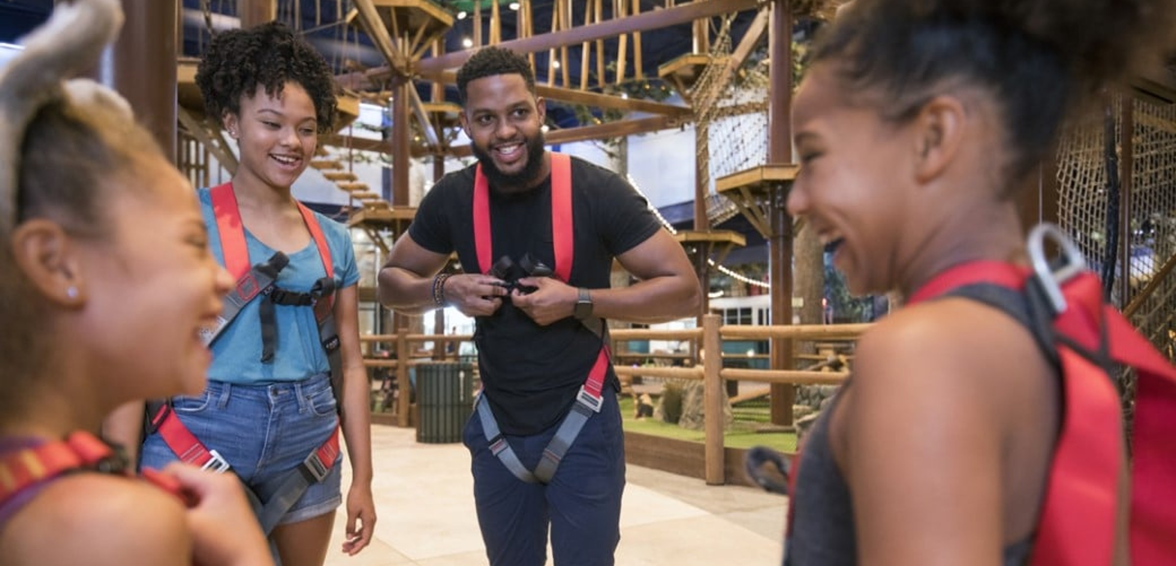 Group of friends at the Howlers Peak Ropes Course at Great Wolf Lodge indoor water park and resort.