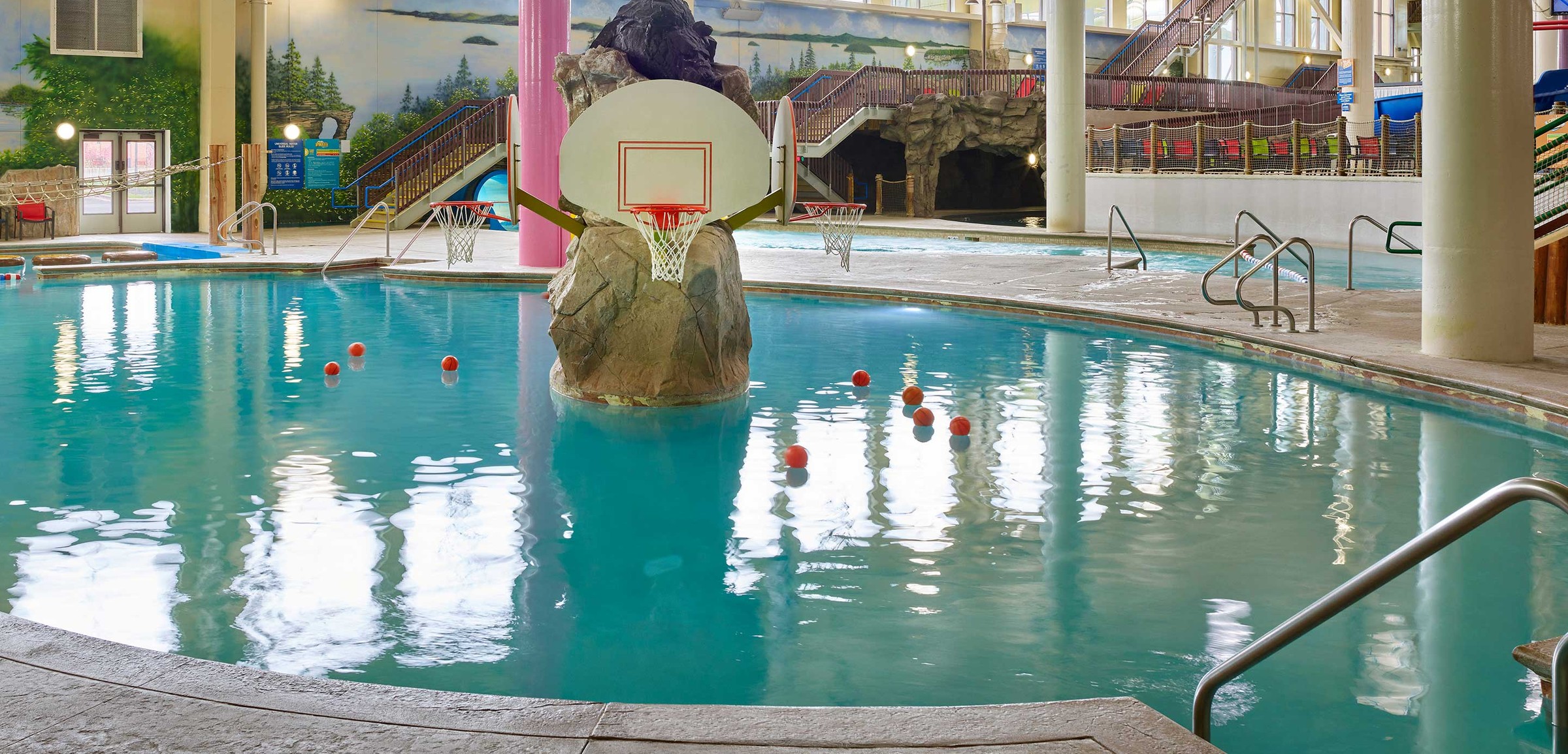basketball hoop and balls in an indoor sports pool